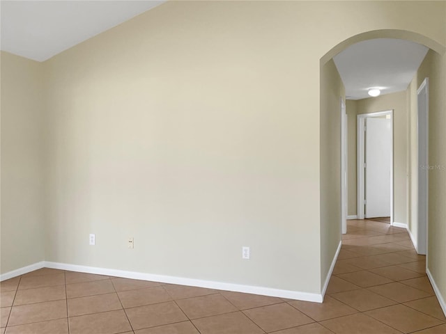 hall featuring light tile patterned flooring