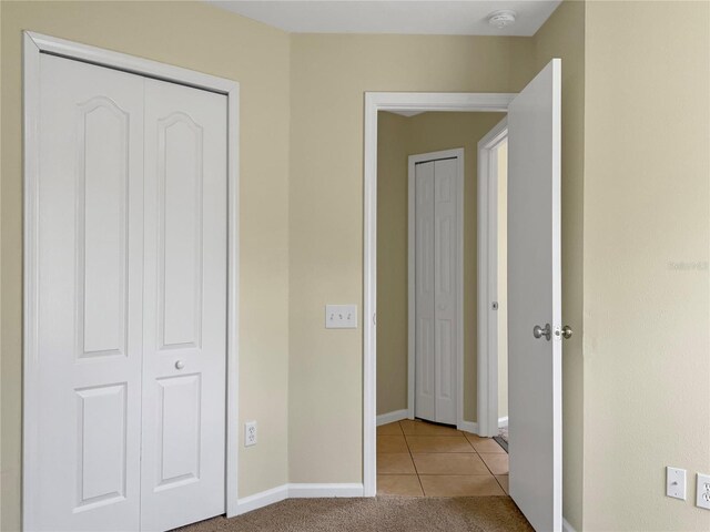 hallway with light tile patterned flooring