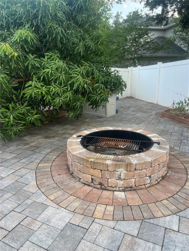 view of patio / terrace with an outdoor fire pit