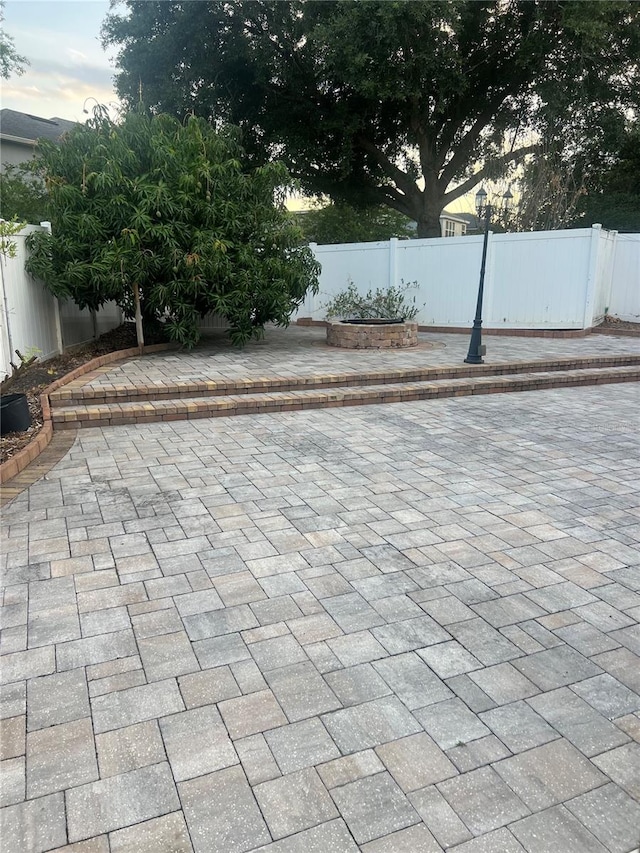 view of patio terrace at dusk