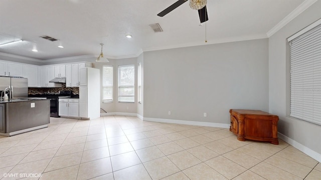 1278 Snug Harbor Dr, Casselberry, FL 32707 - kitchen featuring a ceiling fan, freestanding refrigerator, crown molding, under cabinet range hood, and black range with electric cooktop