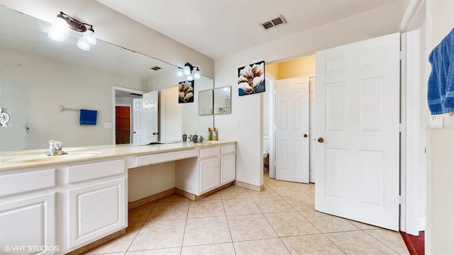 1278 Snug Harbor Dr, Casselberry, FL 32707 - full bath with visible vents, baseboards, a sink, double vanity, and tile patterned floors