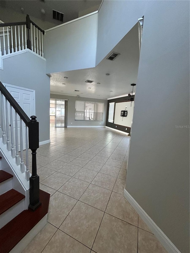 1278 Snug Harbor Dr, Casselberry, FL 32707 - interior space featuring visible vents, baseboards, stairway, and light tile patterned floors