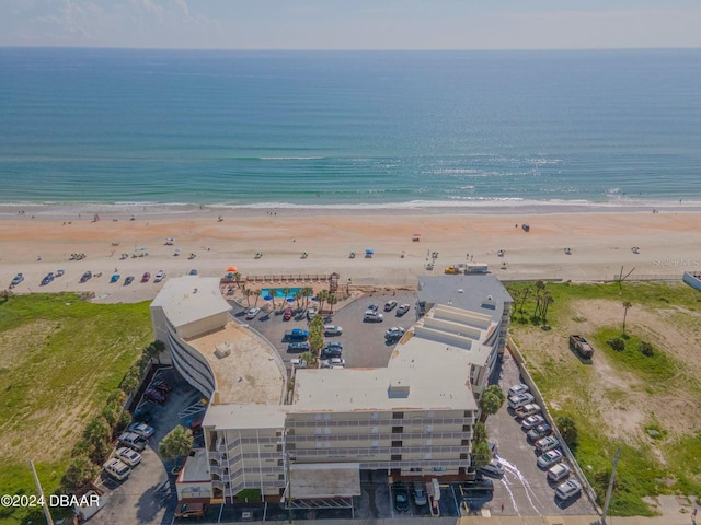 aerial view featuring a view of the beach and a water view