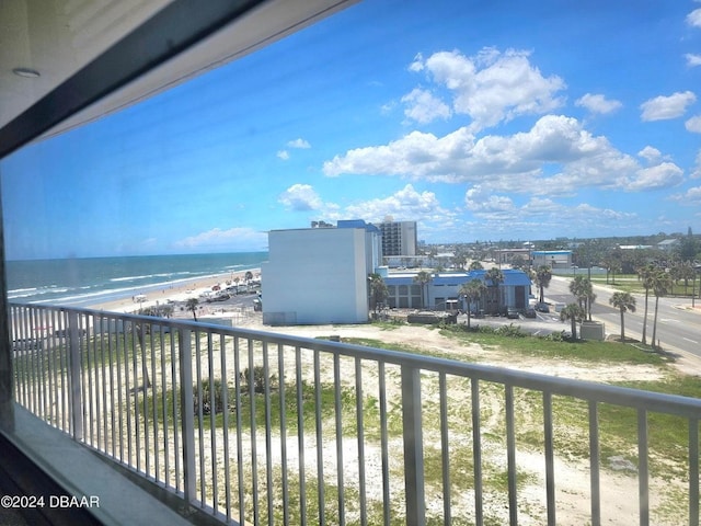 balcony with a view of the beach and a water view