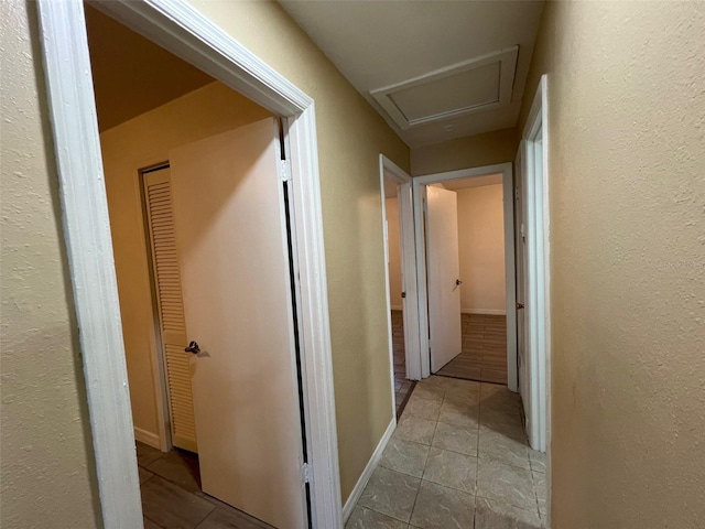 corridor with light tile patterned floors