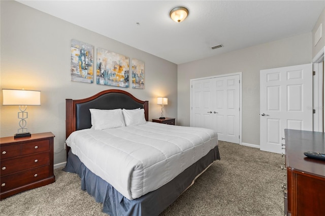 carpeted bedroom featuring a closet