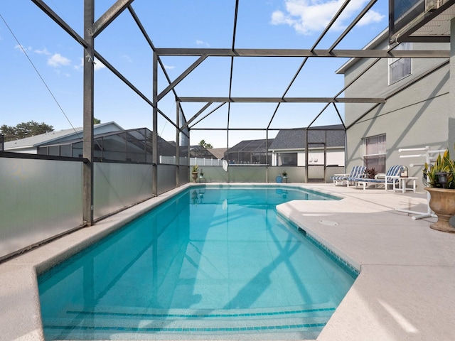 view of pool featuring a lanai and a patio