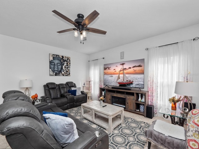 living room with light tile patterned floors and ceiling fan