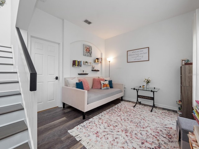 living room featuring dark wood-type flooring