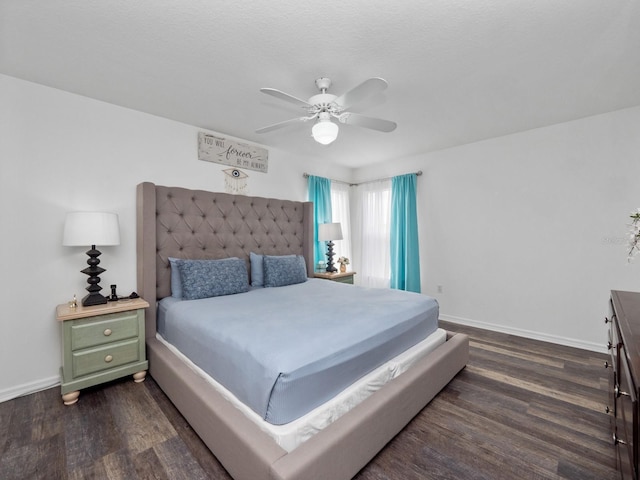 bedroom with ceiling fan and dark wood-type flooring