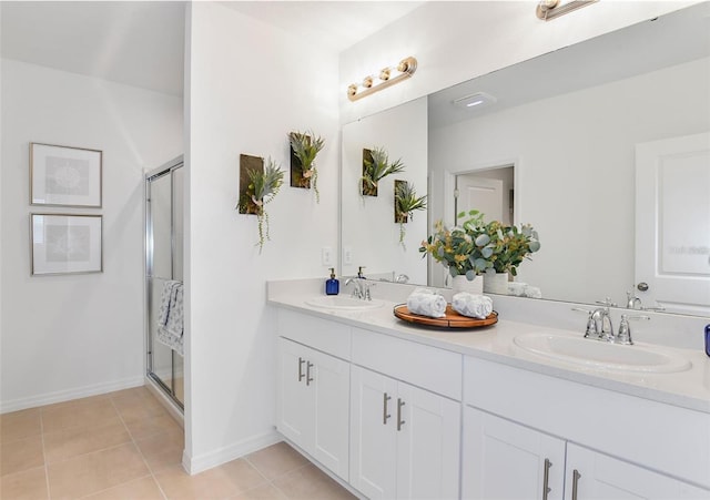 bathroom with vanity, tile patterned flooring, and an enclosed shower