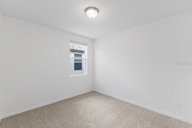 spare room featuring carpet flooring