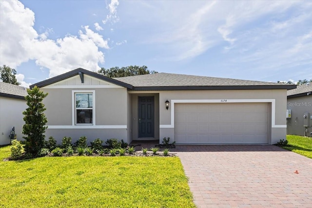 ranch-style house with a front lawn and a garage