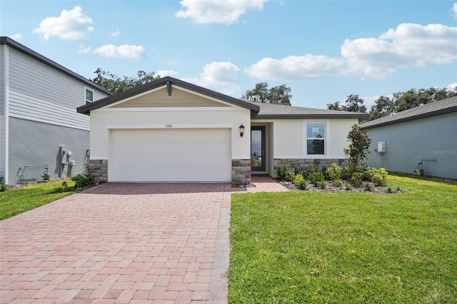 view of front of property with a garage and a front yard