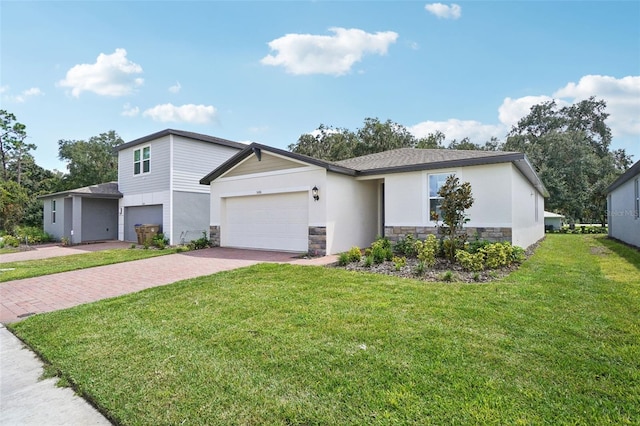 view of front facade featuring a garage and a front lawn