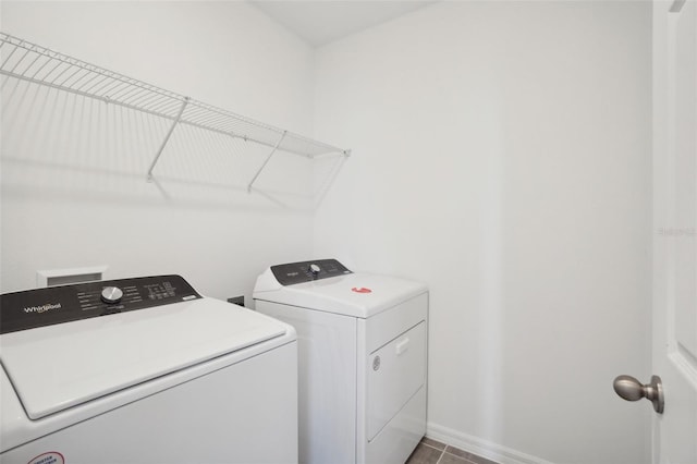 laundry area with tile patterned floors and independent washer and dryer