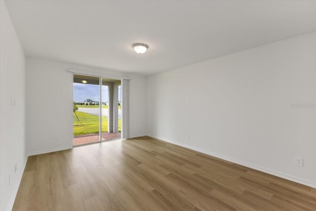 empty room with light hardwood / wood-style floors