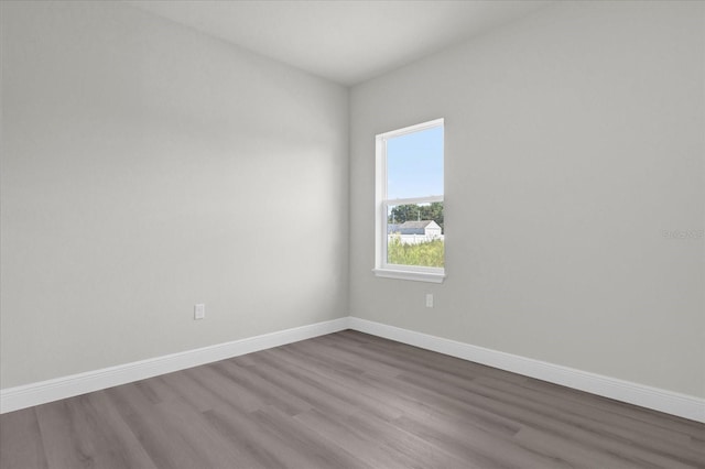 unfurnished room featuring hardwood / wood-style floors