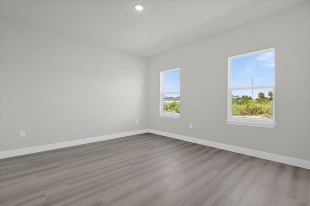 spare room with light hardwood / wood-style flooring