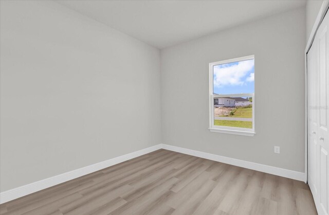 4683 SW 136th St, Ocala, FL 34473 - unfurnished bedroom featuring light wood-type flooring, baseboards, and a closet