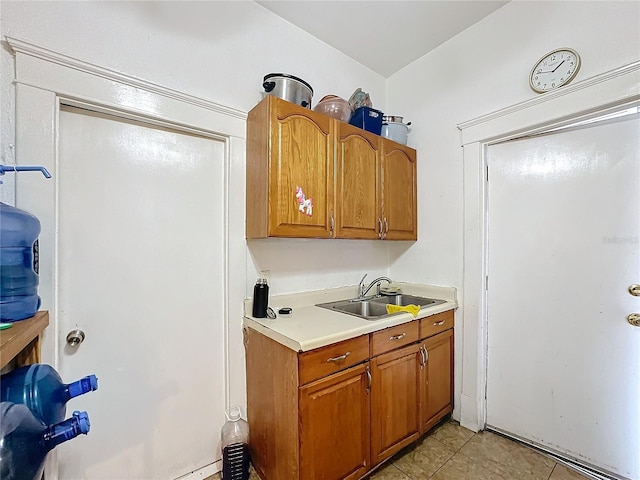 kitchen with light tile patterned flooring and sink