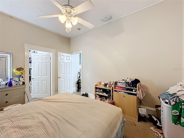 bedroom featuring light colored carpet and ceiling fan