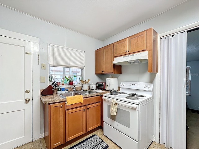 kitchen featuring white range with electric stovetop and sink