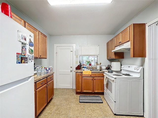 kitchen featuring white appliances and light tile patterned floors