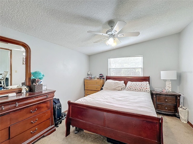 carpeted bedroom featuring a textured ceiling, ceiling fan, and lofted ceiling