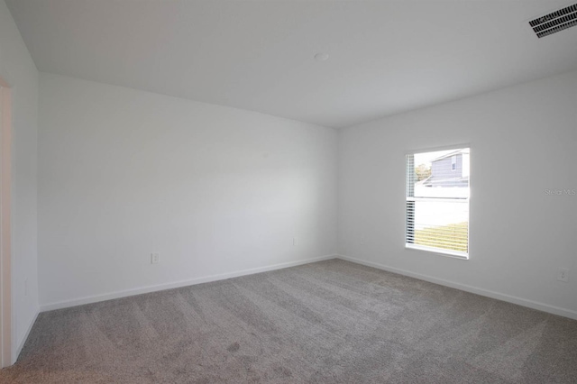 unfurnished room featuring carpet flooring