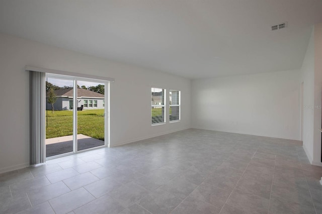 empty room with light tile patterned floors