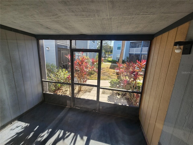 unfurnished sunroom with a healthy amount of sunlight