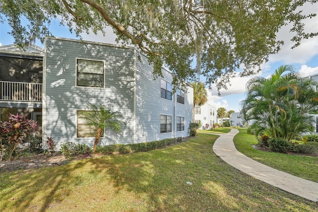 view of home's exterior featuring a lawn