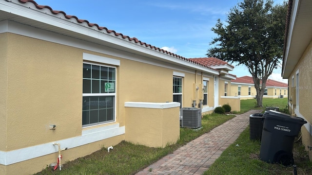 view of property exterior featuring central AC