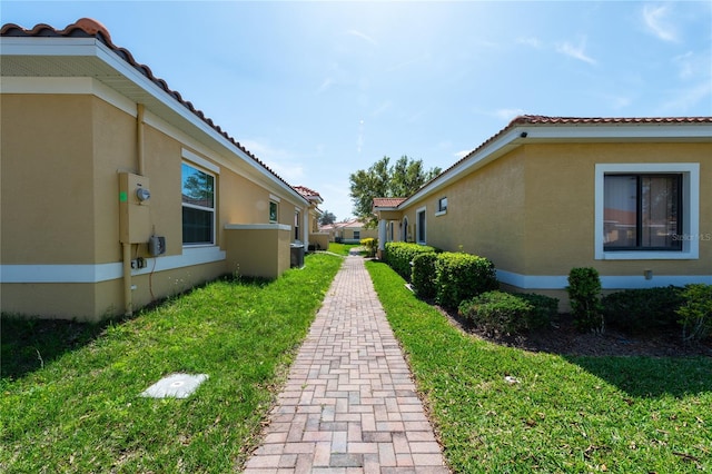 view of home's exterior with a yard