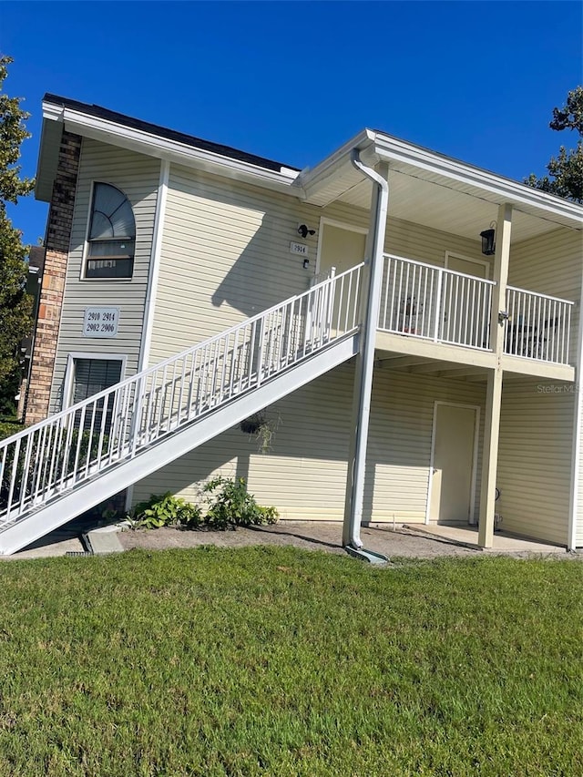 view of property exterior featuring a lawn