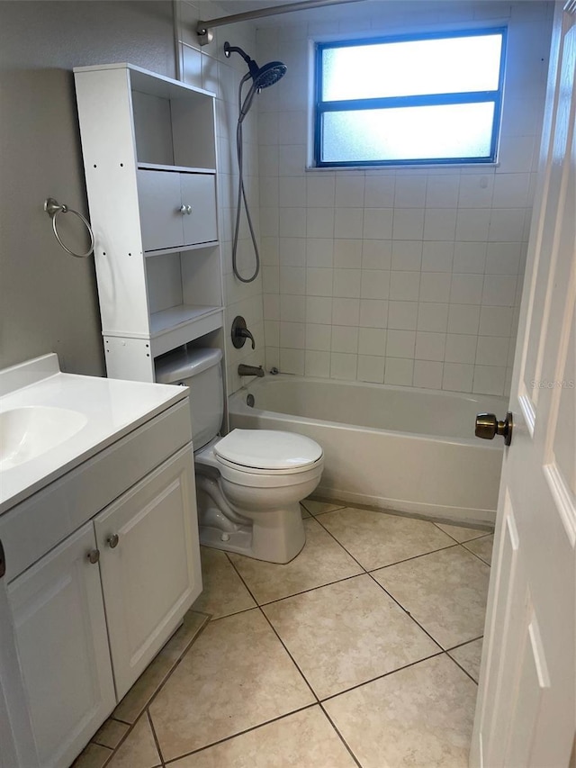 full bath featuring toilet, tile patterned flooring, washtub / shower combination, and vanity