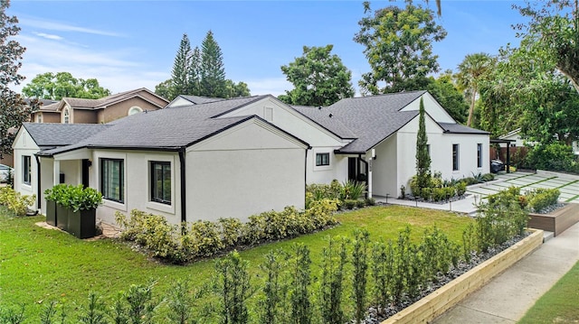 view of home's exterior with a lawn