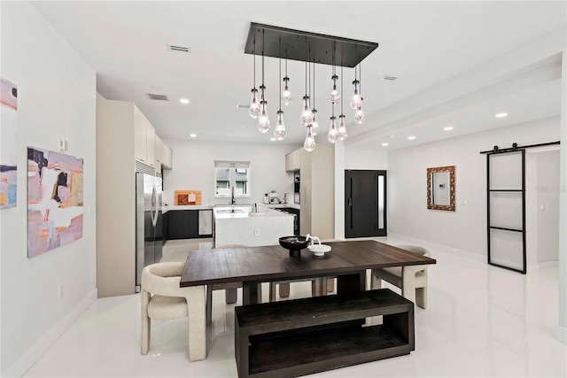 dining room with light tile patterned flooring and sink