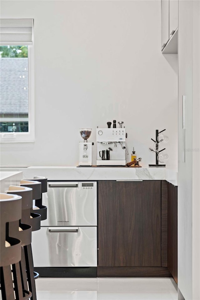 bar with dark brown cabinets and white cabinets