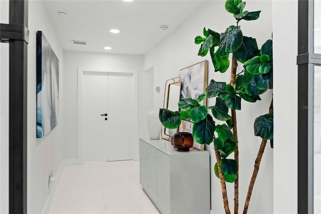 entryway featuring light tile patterned floors