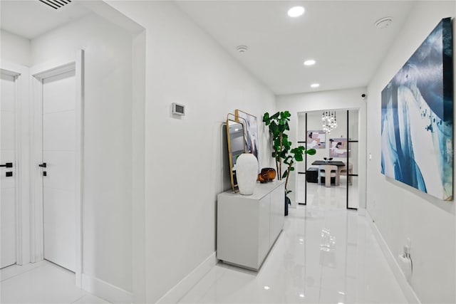 hallway featuring light tile patterned floors