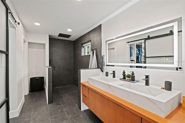 bathroom with vanity, a shower, and tile patterned flooring