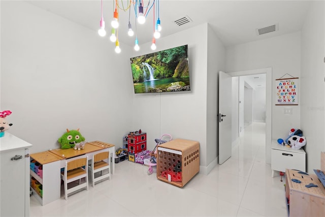 recreation room with light tile patterned flooring