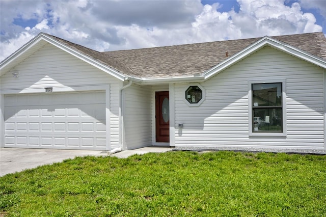 ranch-style home with a front yard and a garage