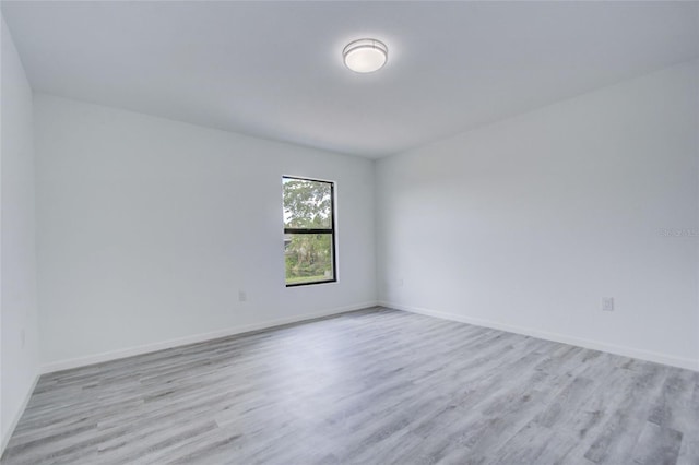 unfurnished room featuring light hardwood / wood-style floors