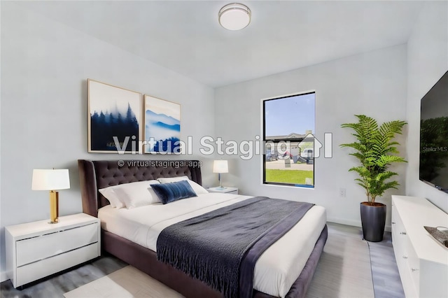 bedroom with wood-type flooring