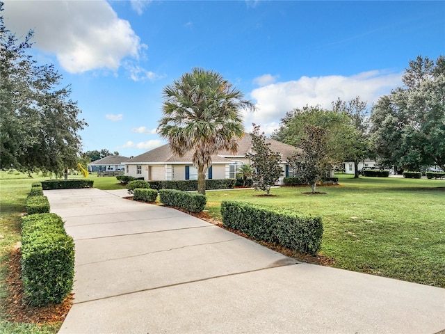 view of front of property with a front lawn