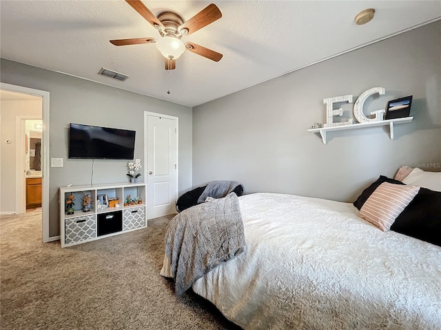 carpeted bedroom with baseboards, visible vents, and ceiling fan
